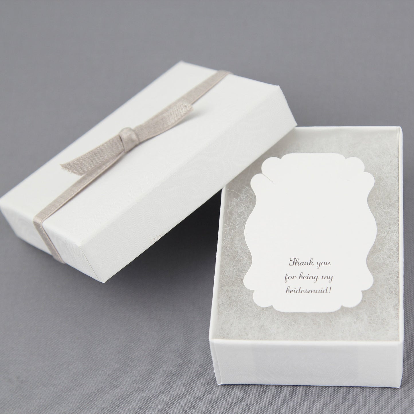 white gift box with ribbon