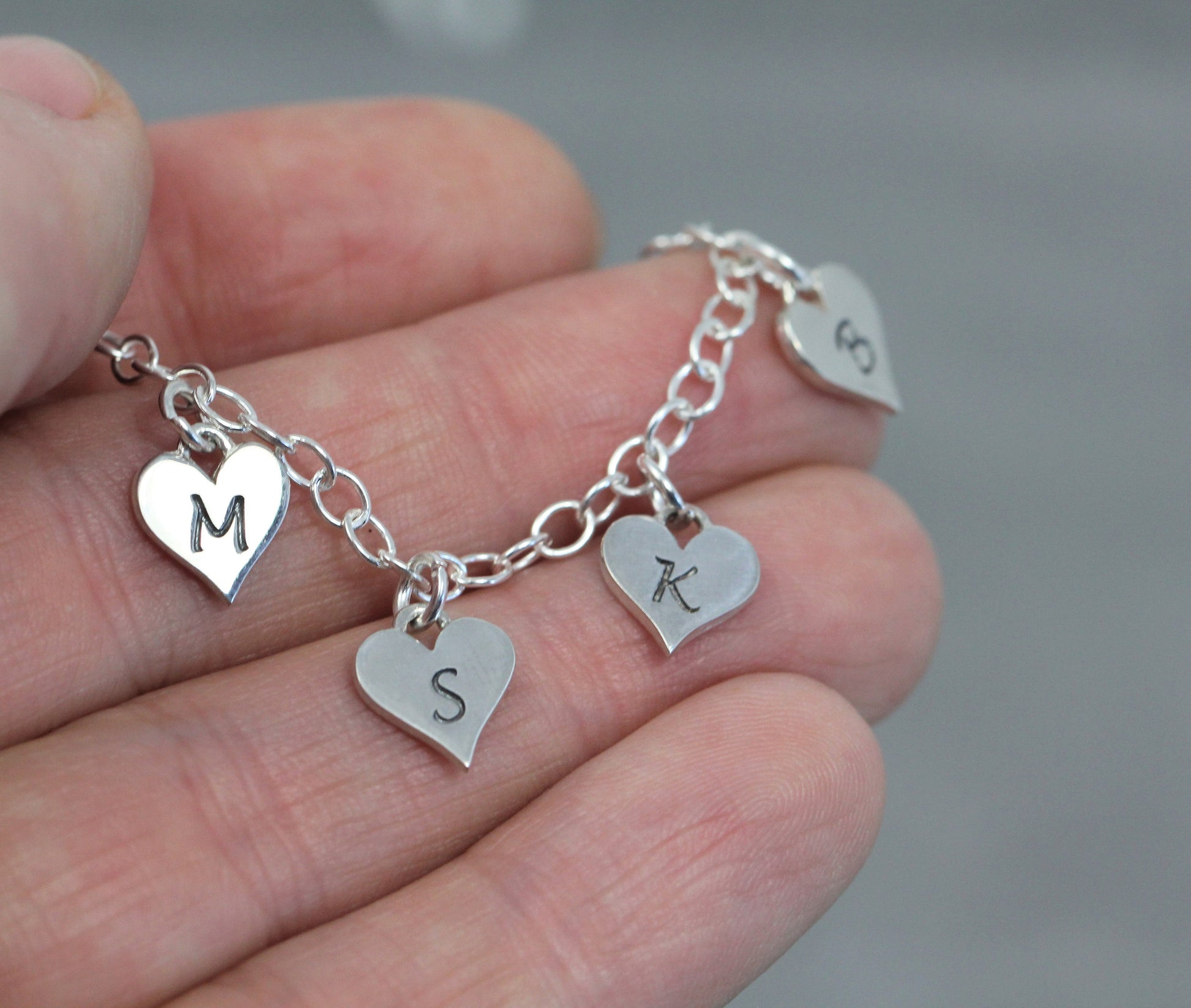 Size photo of heart charms in bracelet